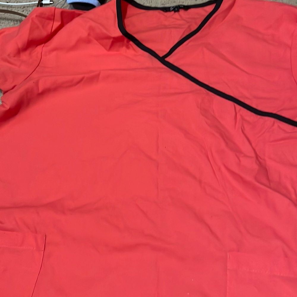 Salmon pink scrub top.
